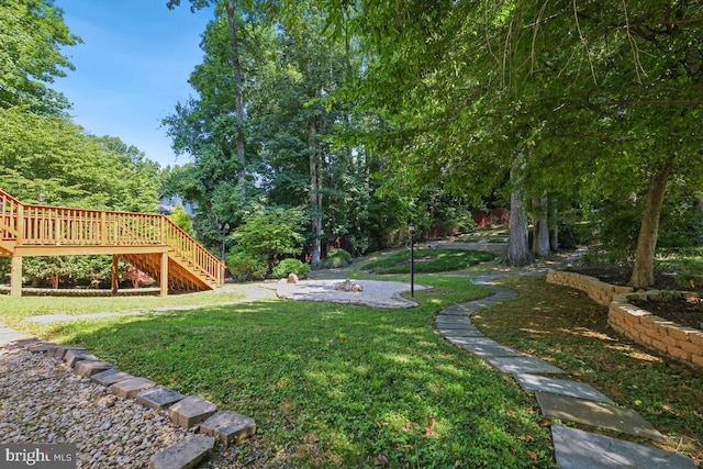 view of yard featuring a wooden deck