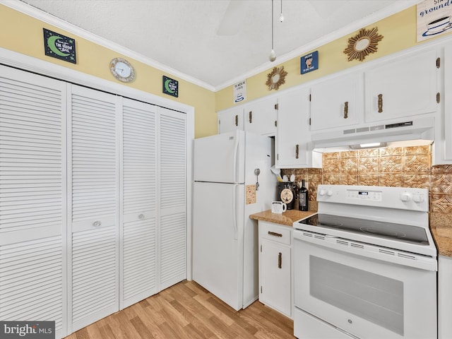 kitchen featuring backsplash, white appliances, white cabinets, custom exhaust hood, and ornamental molding