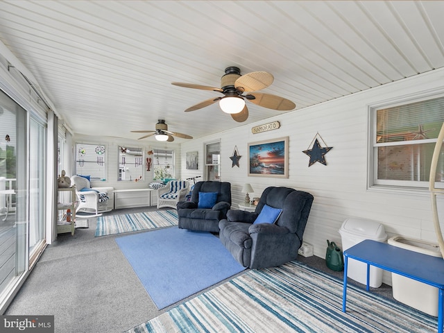 sunroom / solarium featuring ceiling fan