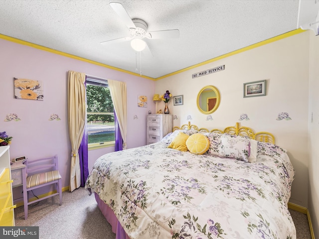 carpeted bedroom featuring ceiling fan and a textured ceiling