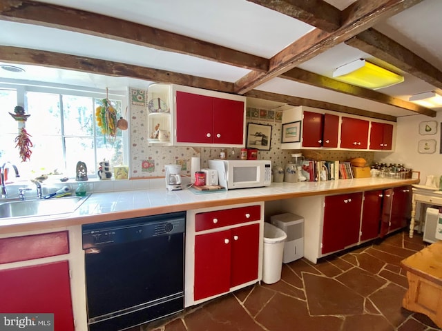 kitchen featuring beamed ceiling, dishwasher, and sink