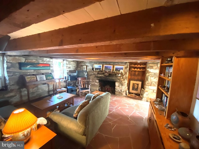 living room featuring a fireplace and beamed ceiling