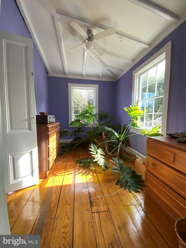 interior space with light wood-type flooring, ceiling fan, and lofted ceiling