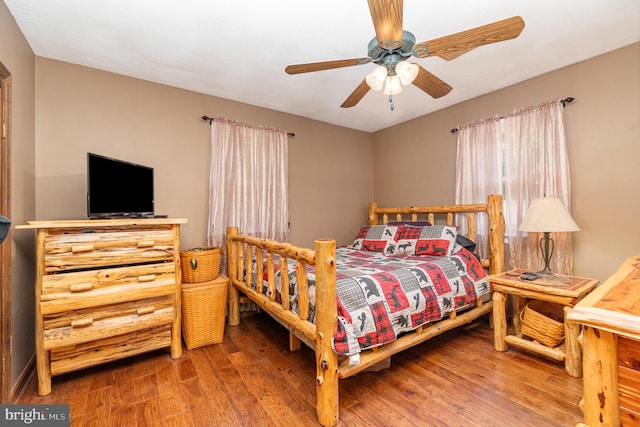 bedroom featuring ceiling fan and wood-type flooring