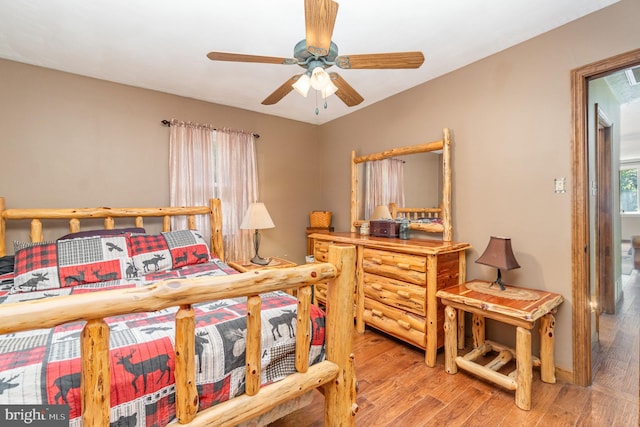 bedroom with light hardwood / wood-style flooring and ceiling fan