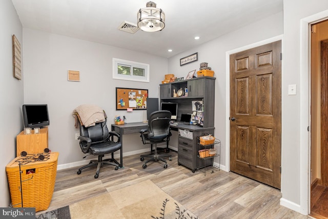 home office featuring light hardwood / wood-style flooring