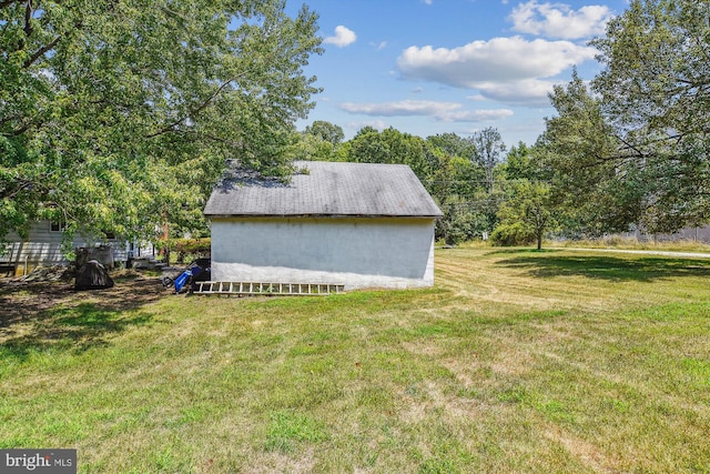 view of outdoor structure featuring a lawn