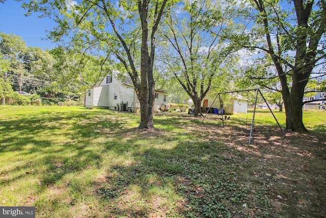 view of yard featuring central AC