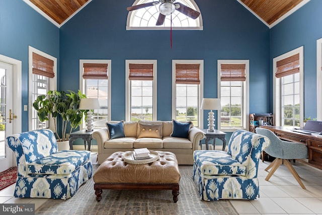 tiled living room with high vaulted ceiling, a wealth of natural light, and wood ceiling