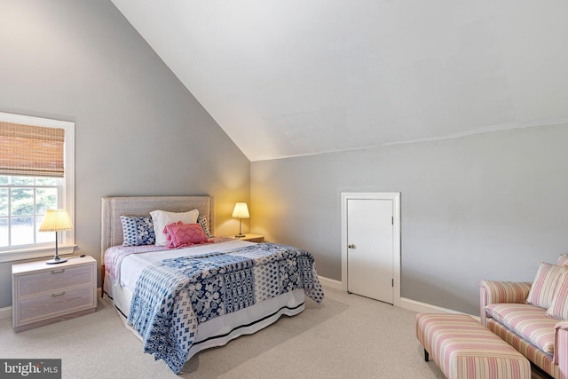 carpeted bedroom with vaulted ceiling