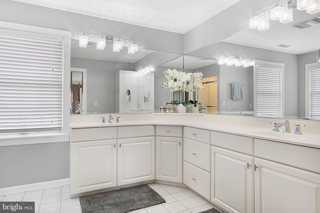 bathroom featuring tile patterned flooring and vanity