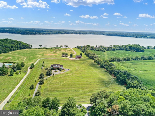 birds eye view of property with a rural view and a water view