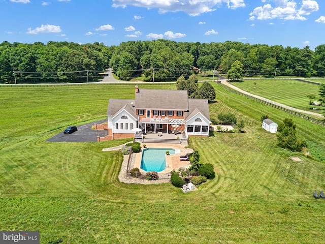 birds eye view of property featuring a rural view