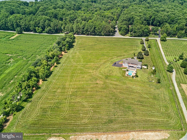 birds eye view of property with a rural view