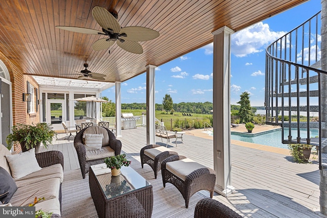 deck featuring ceiling fan and an outdoor hangout area