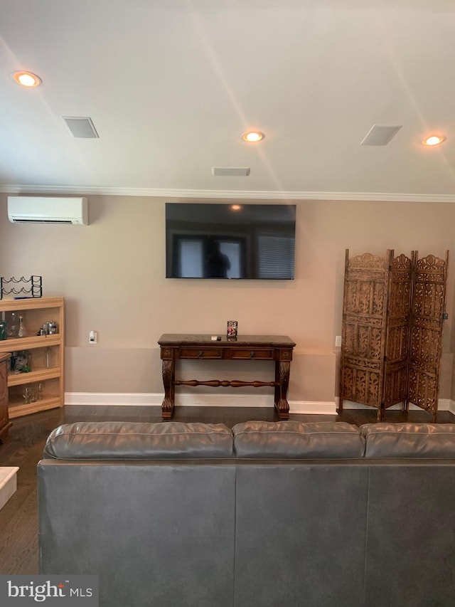 living room featuring a wall unit AC and ornamental molding