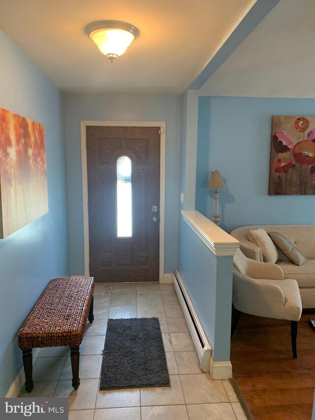 tiled entrance foyer with baseboard heating