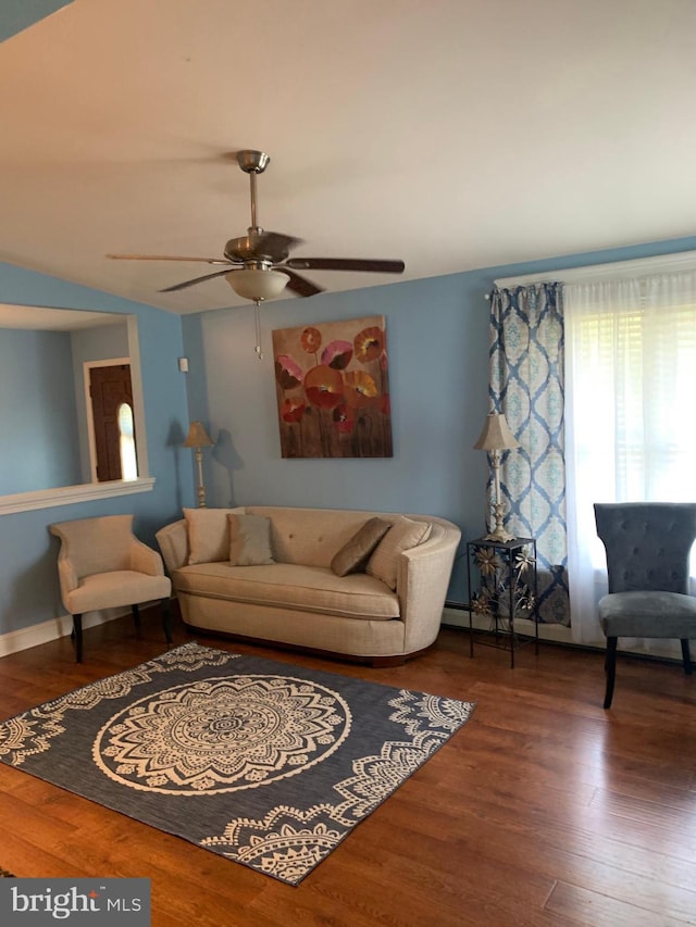 living room with ceiling fan and hardwood / wood-style flooring