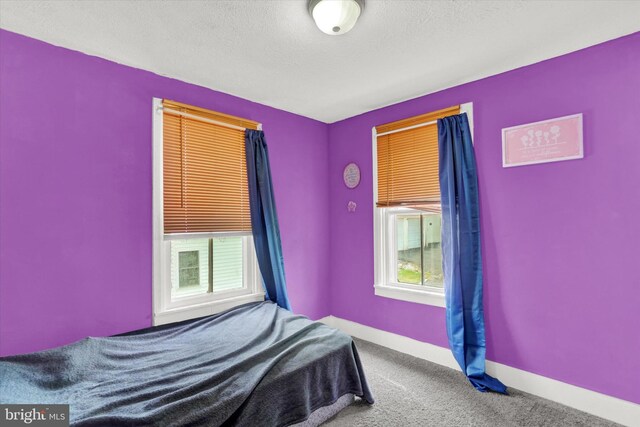 unfurnished bedroom with carpet flooring