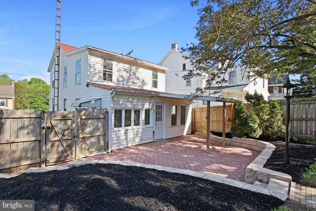 back of house featuring a patio