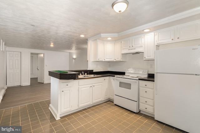 28 N 4th St, Steelton, PA 17113 - kitchen featuring white cabinetry, sink, white appliances, and kitchen peninsula