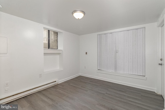 28 N 4th St, Steelton, PA 17113 - unfurnished room with dark wood-type flooring and a baseboard heating unit