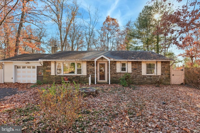 ranch-style house featuring a garage