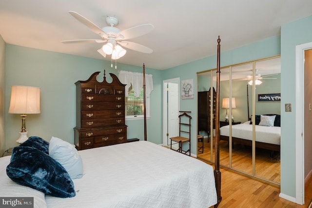 bedroom with wood finished floors, a closet, and ceiling fan