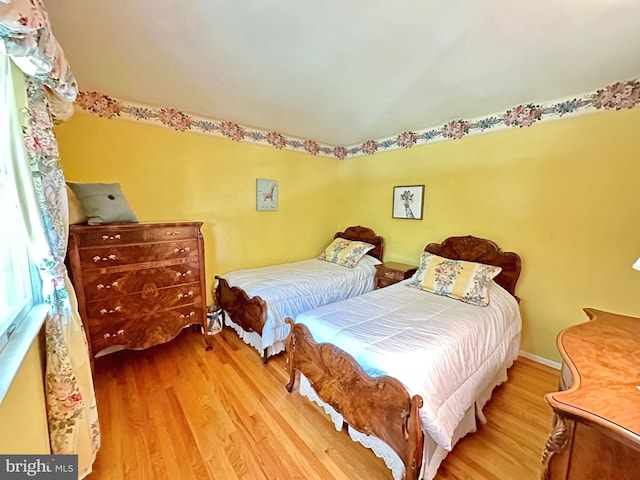 bedroom with wood finished floors