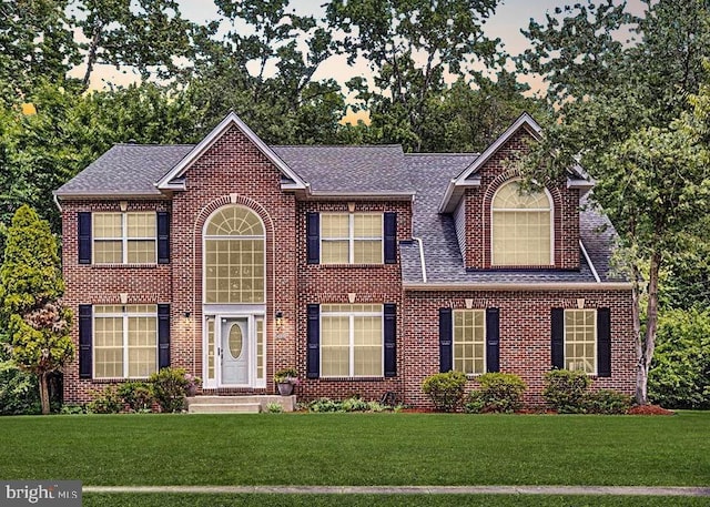 view of front of home with a front lawn