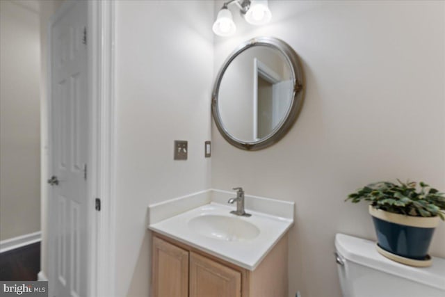 bathroom with vanity and toilet