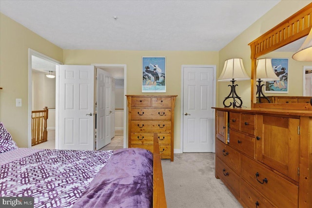 bedroom featuring light colored carpet