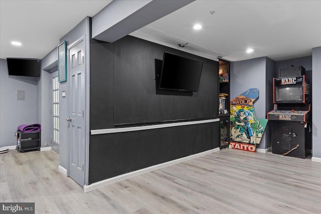 recreation room with light hardwood / wood-style flooring