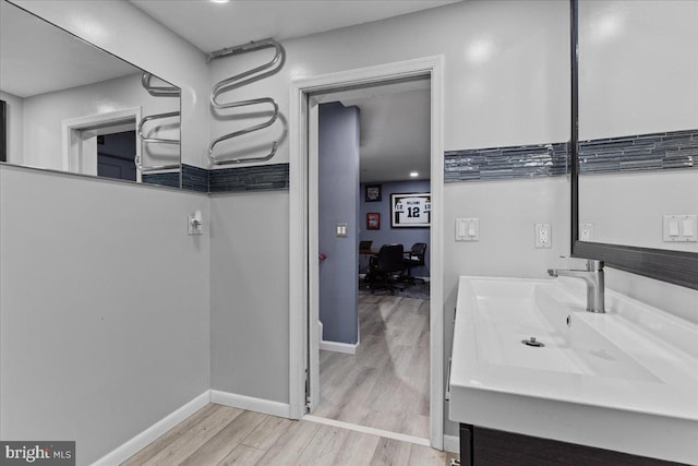 bathroom featuring wood-type flooring and vanity