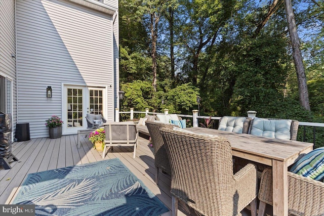 deck featuring outdoor lounge area and french doors