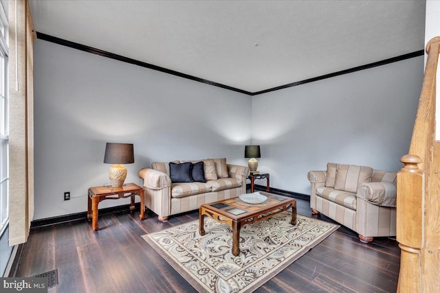 living room with dark wood-type flooring and ornamental molding