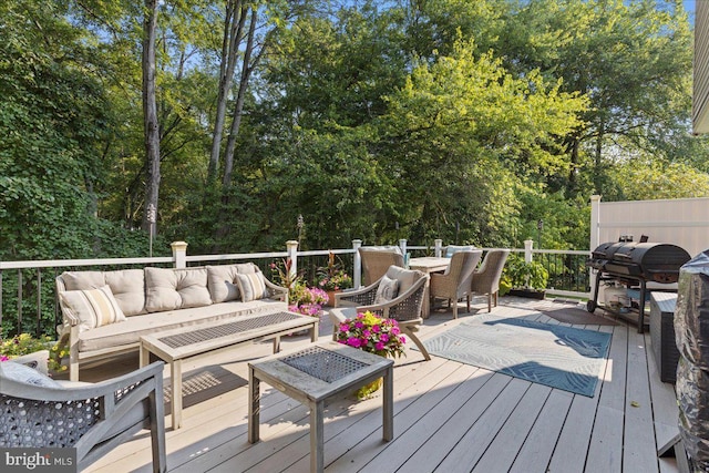 deck featuring grilling area and an outdoor hangout area