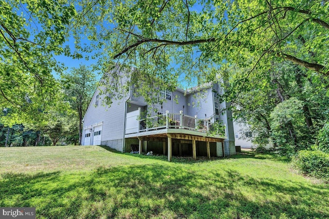 view of yard featuring a garage and a deck