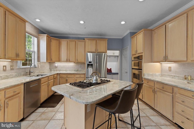 kitchen featuring light stone countertops, stainless steel appliances, a kitchen island, and sink