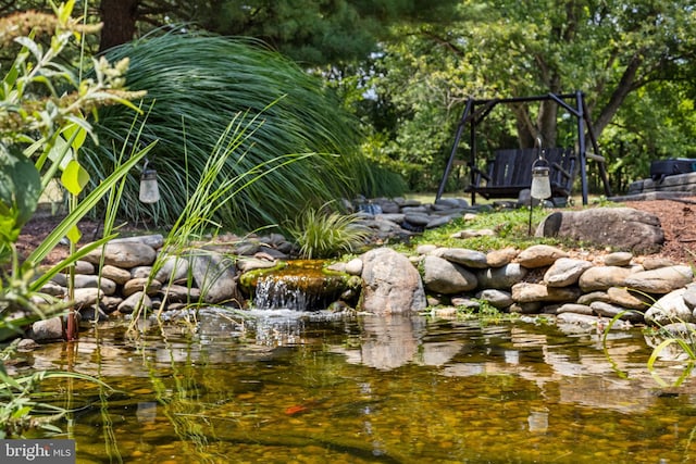 view of yard with a garden pond