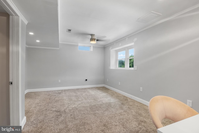 spare room featuring carpet flooring, ceiling fan, and ornamental molding