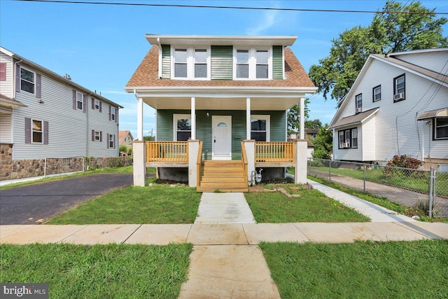 view of front of home with a front lawn and covered porch