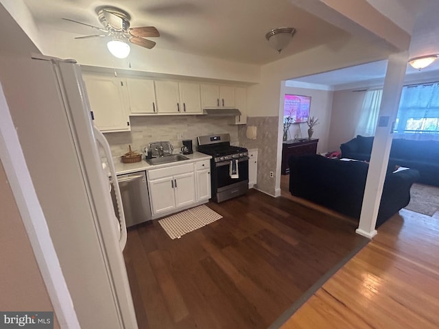 kitchen featuring sink, dark hardwood / wood-style flooring, white cabinets, and stainless steel appliances