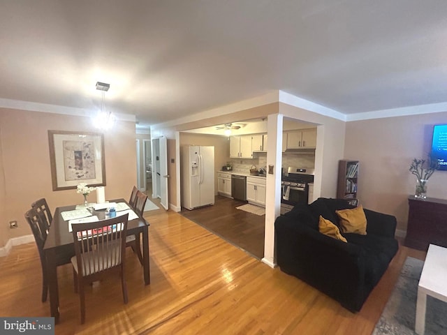 dining space featuring hardwood / wood-style floors