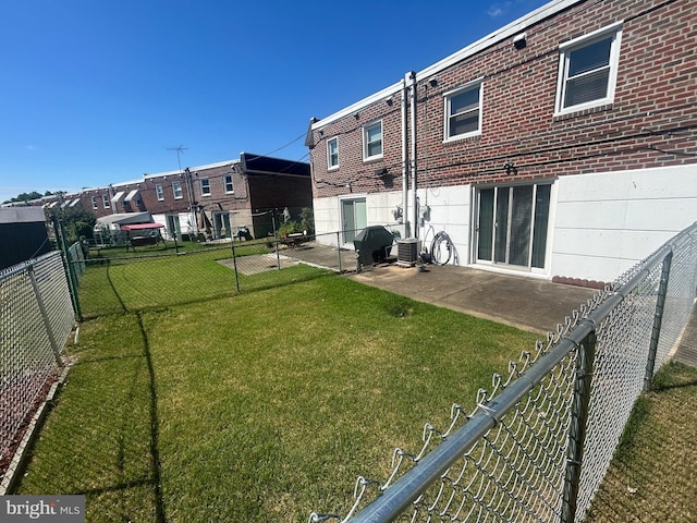 view of yard with a patio area and central AC