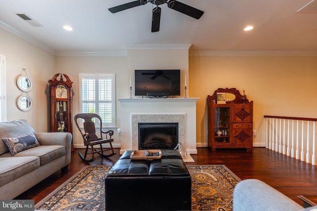 living room with ceiling fan, dark hardwood / wood-style flooring, and ornamental molding