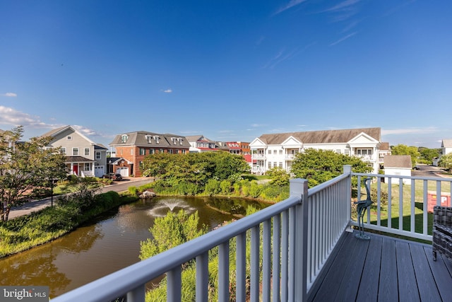 wooden terrace with a water view