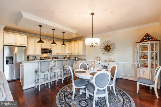 dining area with a chandelier, crown molding, and dark wood-type flooring