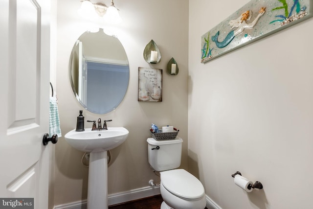 bathroom with toilet and sink