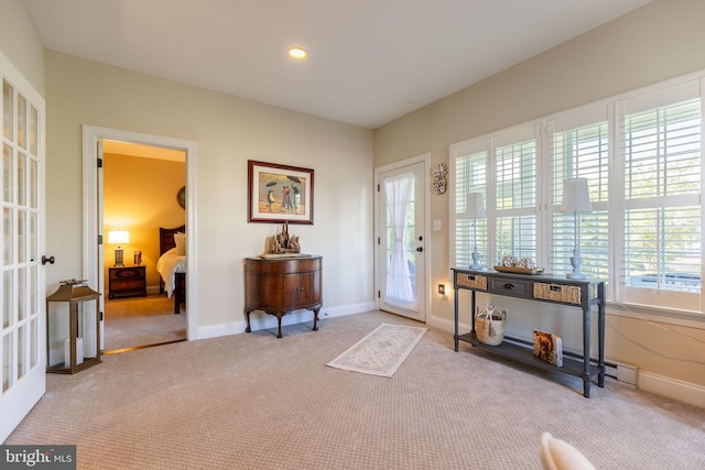 carpeted foyer featuring french doors